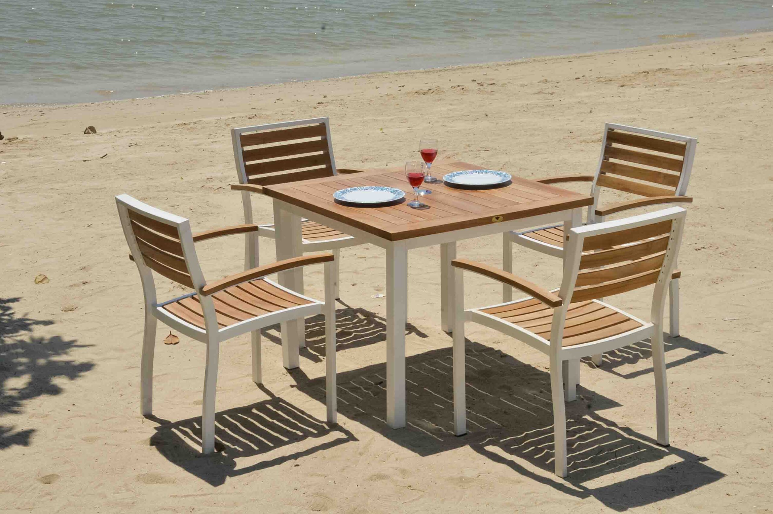 Catalina stacking teak arm chair for outdoor dining and hospitality use